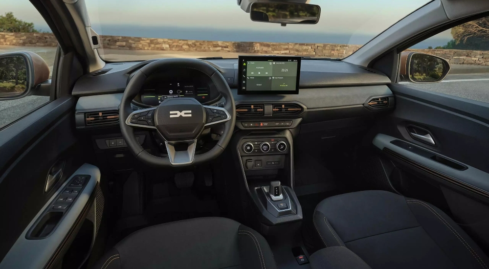 Dacia Sandero Stepway interior showing the seats, steering wheel and centre console.
