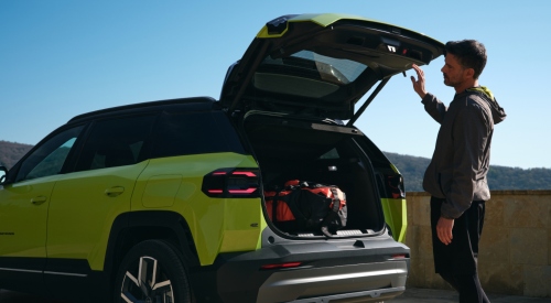 Man opening the boot of a New Jeep Compass Full-Electric; New Jeep Compass Full-Electric models