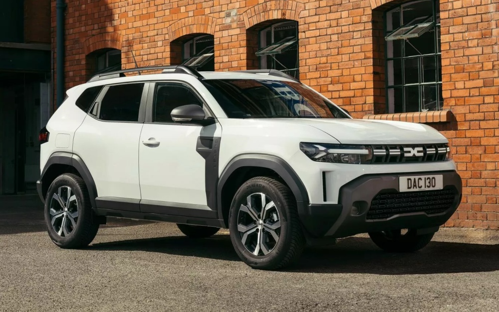 White Dacia Duster Cargo Hybrid front three quarter view.