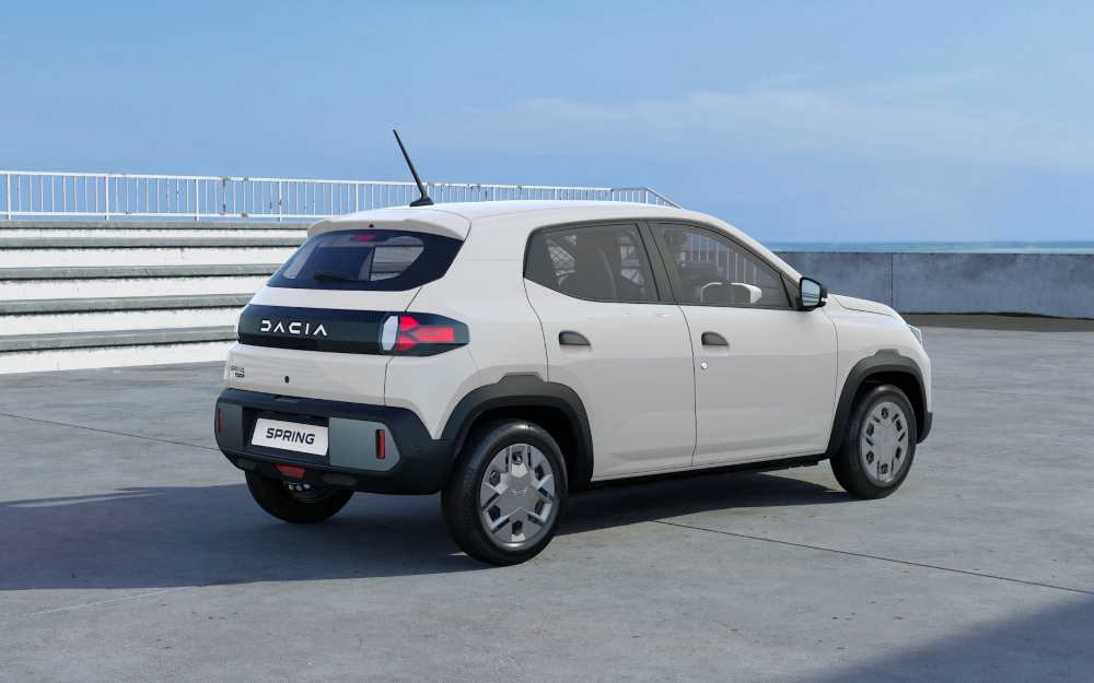 White Dacia Spring Cargo Electric rear three quarter view.