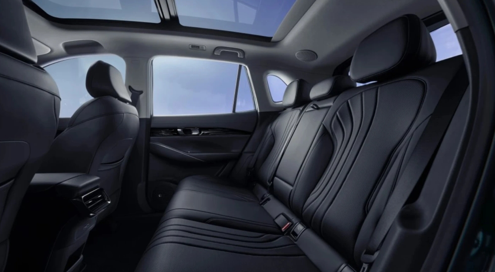 New Geely Starray EM-i interior, rear seat view with panoramic sunroof and black upholstery.