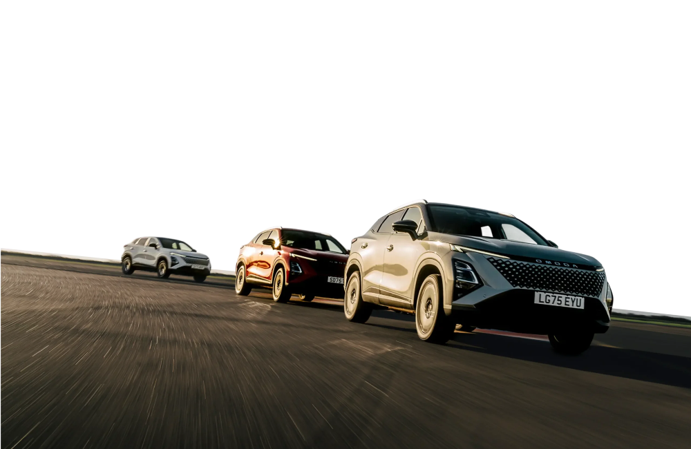 Three OMODA cars driving at speed down tarmac.